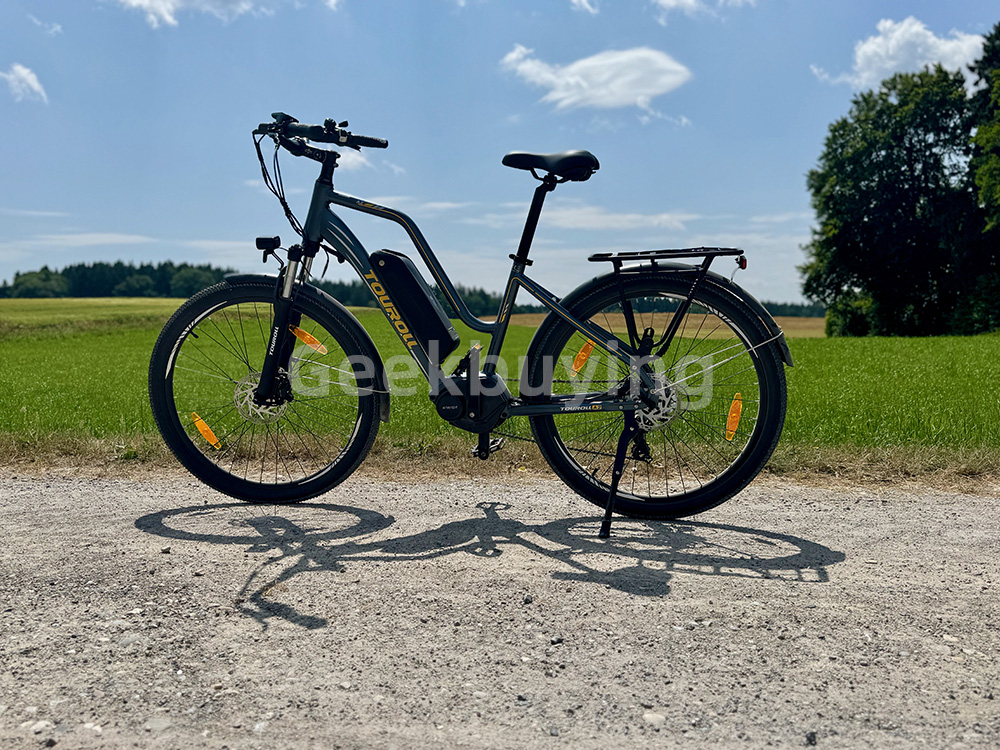Touroll MA2 Vélo électrique, moteur central 250 W, batterie 36 V 13 Ah, pneus 27,5 pouces, vitesse maximale 25 km/h, autonomie maximale 100 km, frein à disque hydraulique, fourche à suspension avec blocage, transmission Shimano 7 vitesses - Marron