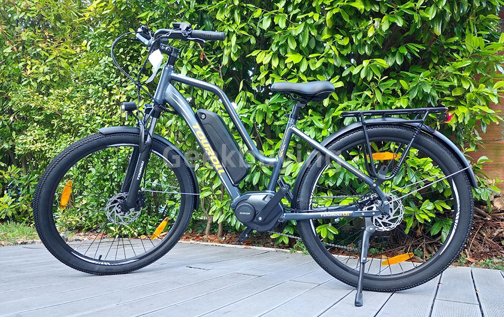 Touroll MA2 Vélo électrique, moteur central 250 W, batterie 36 V 13 Ah, pneus 27,5 pouces, vitesse maximale 25 km/h, autonomie maximale 100 km, frein à disque hydraulique, fourche à suspension avec blocage, transmission Shimano 7 vitesses - Gris