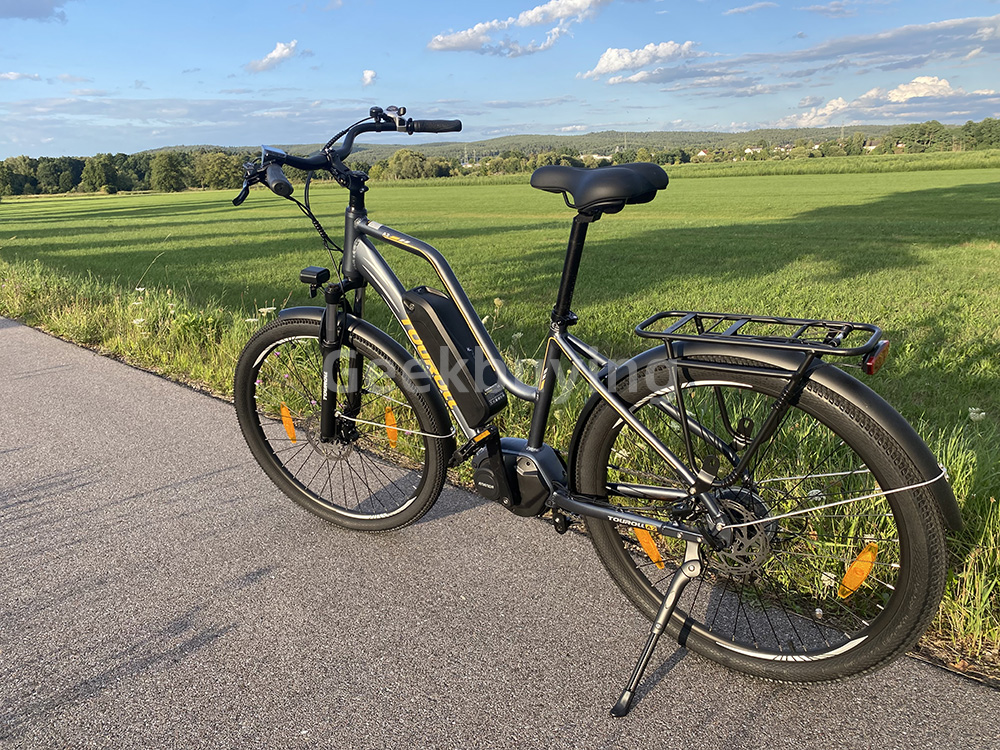 Touroll MA2 Vélo électrique, moteur central 250 W, batterie 36 V 13 Ah, pneus 27,5 pouces, vitesse maximale 25 km/h, autonomie maximale 100 km, frein à disque hydraulique, fourche à suspension avec blocage, transmission Shimano 7 vitesses - Gris