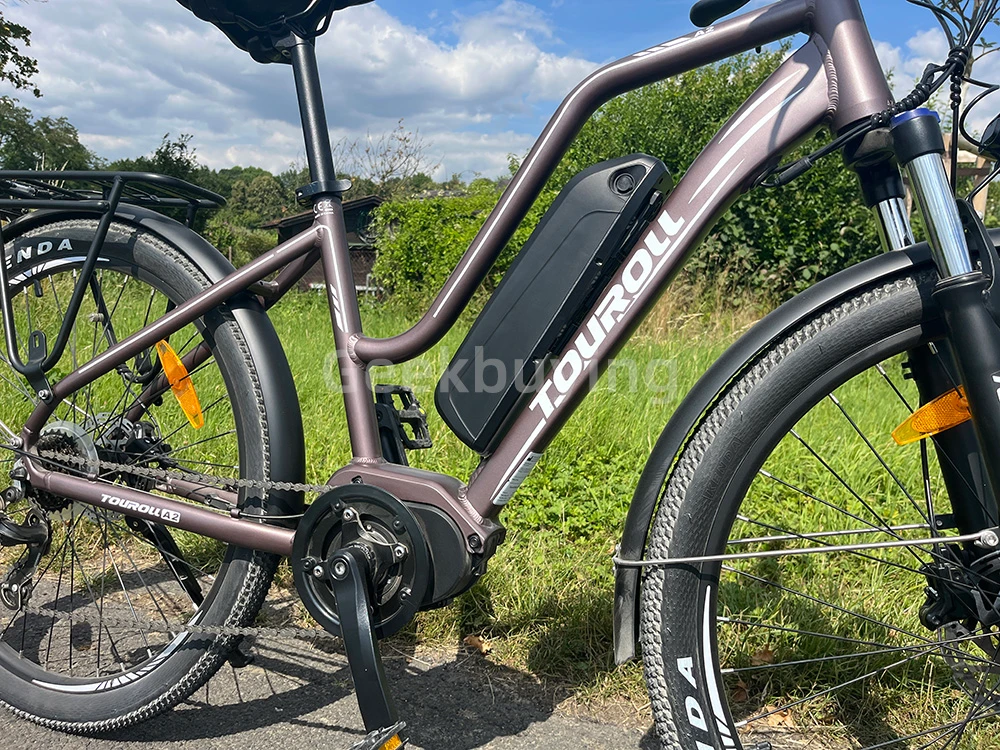 Touroll MA2 Vélo électrique, moteur central 250 W, batterie 36 V 13 Ah, pneus 27,5 pouces, vitesse maximale 25 km/h, autonomie maximale 100 km, frein à disque hydraulique, fourche à suspension avec blocage, transmission Shimano 7 vitesses - Gris