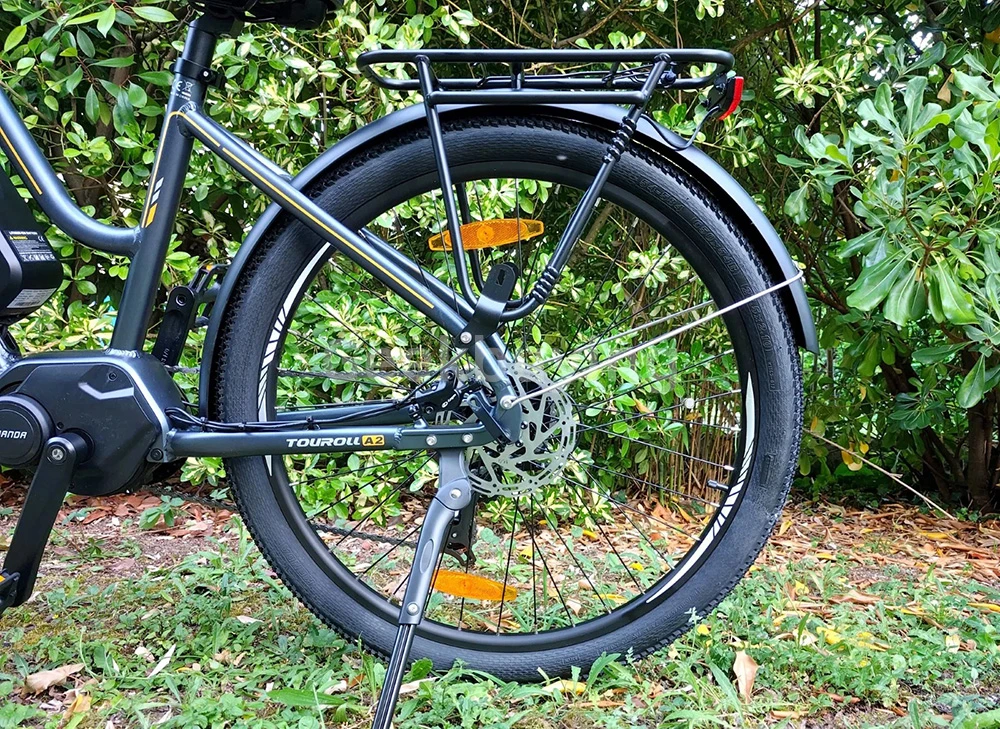 Touroll MA2 Vélo électrique, moteur central 250 W, batterie 36 V 13 Ah, pneus 27,5 pouces, vitesse maximale 25 km/h, autonomie maximale 100 km, frein à disque hydraulique, fourche à suspension avec blocage, transmission Shimano 7 vitesses - Gris