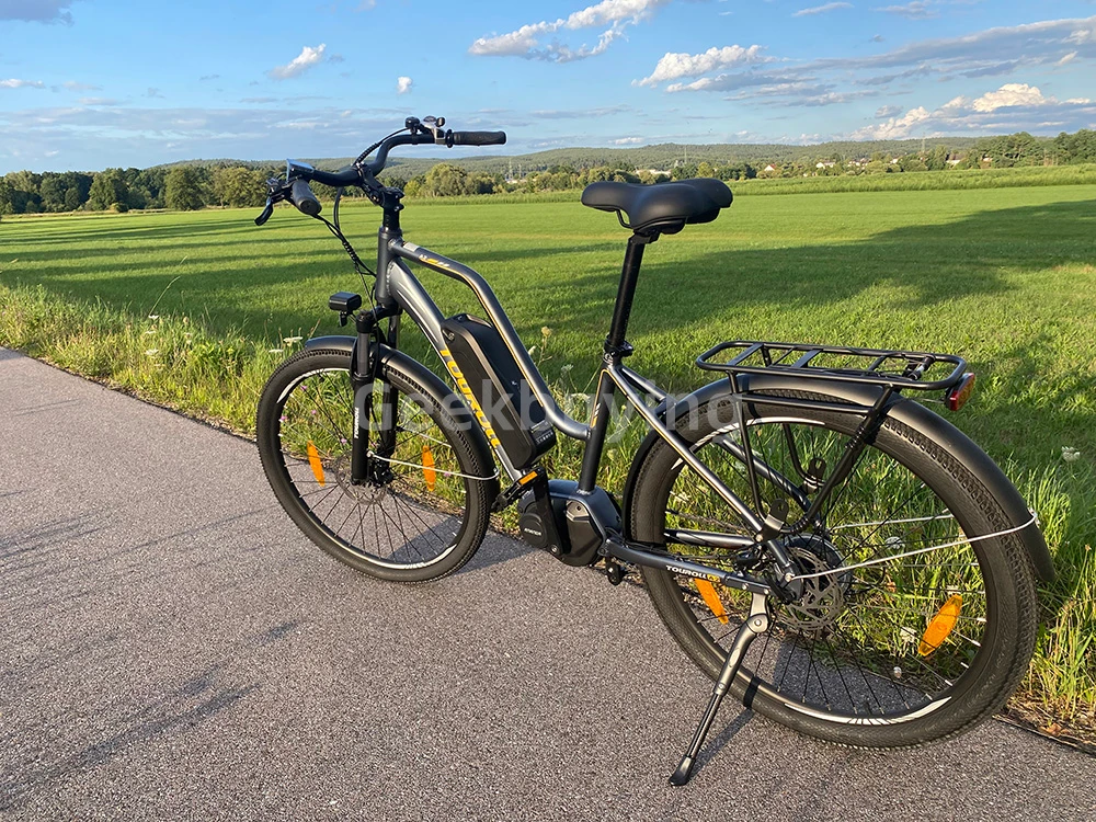 Touroll MA2 Vélo électrique, moteur central 250 W, batterie 36 V 13 Ah, pneus 27,5 pouces, vitesse maximale 25 km/h, autonomie maximale 100 km, frein à disque hydraulique, fourche à suspension avec blocage, transmission Shimano 7 vitesses - Gris