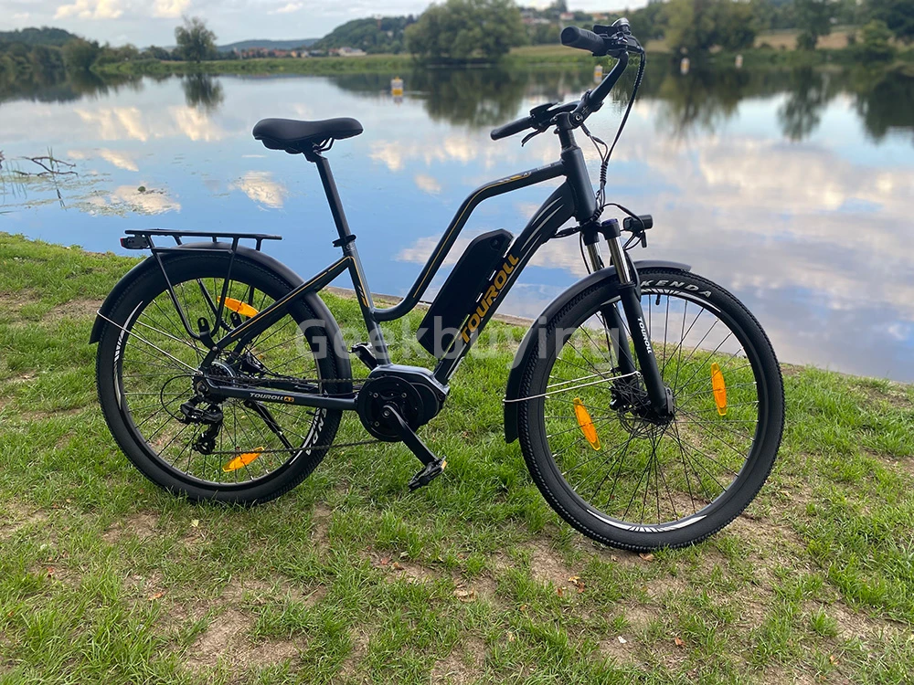 Touroll MA2 Vélo électrique, moteur central 250 W, batterie 36 V 13 Ah, pneus 27,5 pouces, vitesse maximale 25 km/h, autonomie maximale 100 km, frein à disque hydraulique, fourche à suspension avec blocage, transmission Shimano 7 vitesses - Gris