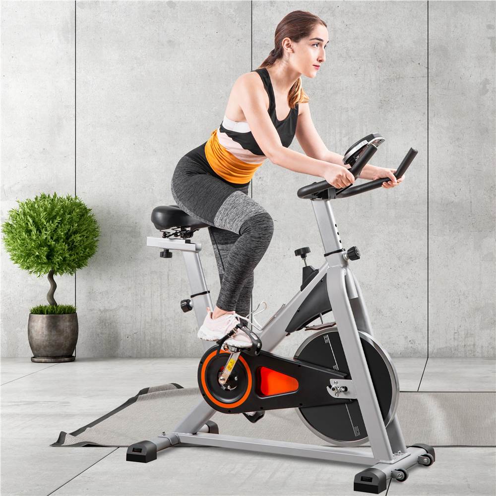 

Merax Indoor Cycling Bike Stationary, Belt Driven Smooth Exercise Bike Supports 330 LBS Weight with Oversize Soft Saddle and LCD Monitor - Black and Orange